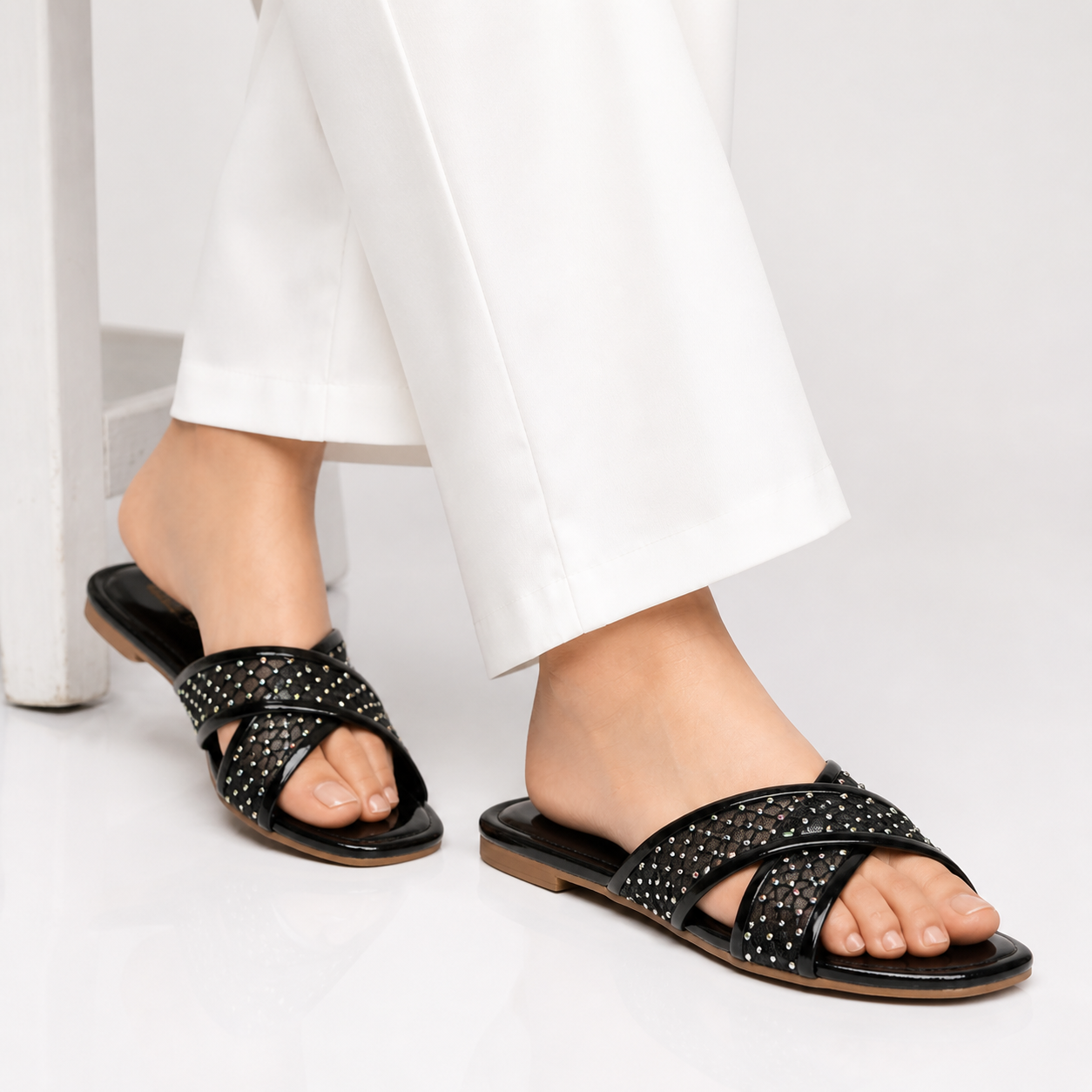 Black Rozy flat slipper by Finsha Shoes with a cozy, comfortable design and soft fabric upper for casual wear.