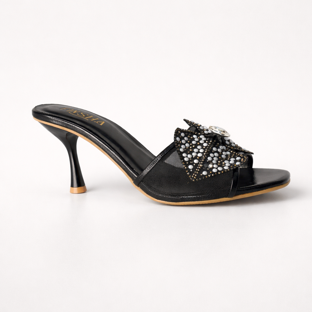 Silver wedding shoes with floral accents by Finsha Shoes, featuring a stylish and festive heel design.