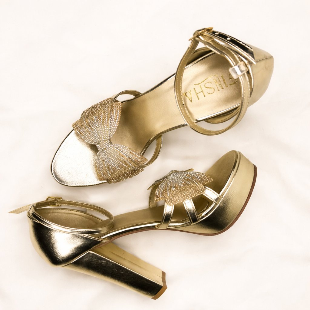 Gold LYNIX 5-inch platform heel by Finsha Shoes, featuring a stylish high heel and chunky platform for added height and comfort.