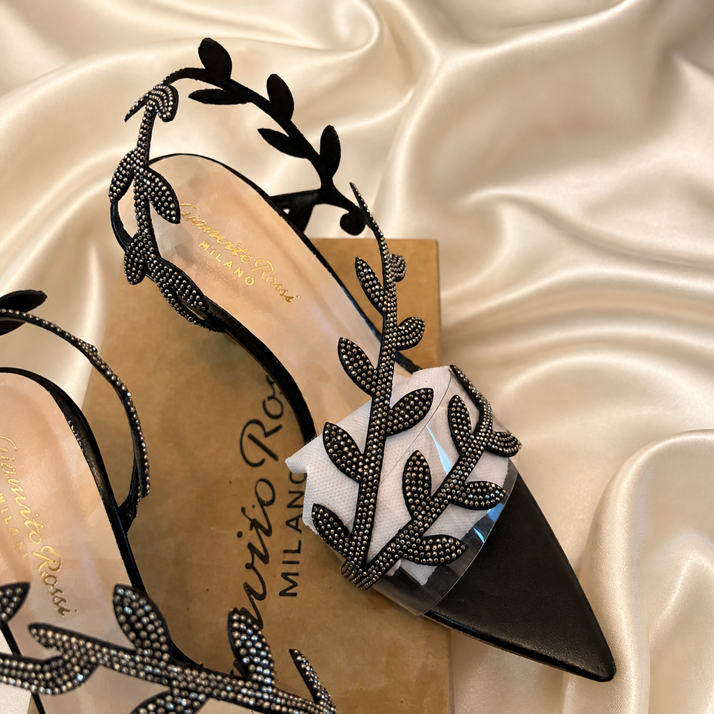 Black leaf-embellished open toe heel sandal by Finsha Shoes, featuring a stylish leaf decoration on the strap.